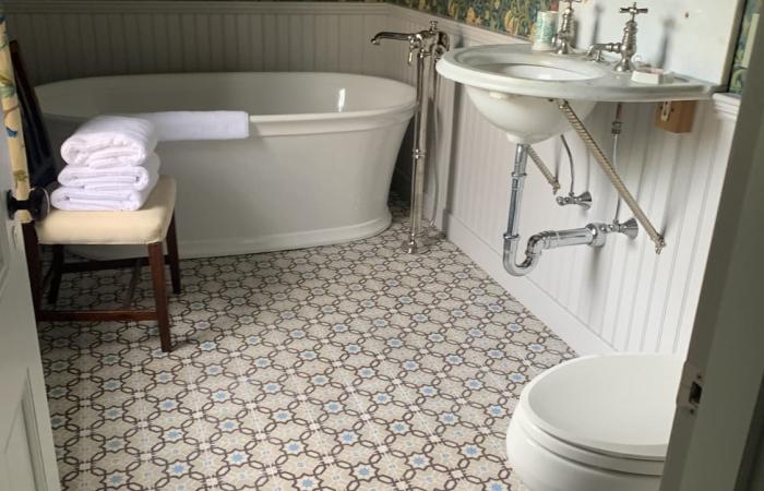 A 1913 Octave Colozier ceramic in a Massachusetts bathroom 
