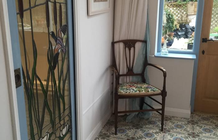 A period French ceramic floor in a London conservatory and bathroom