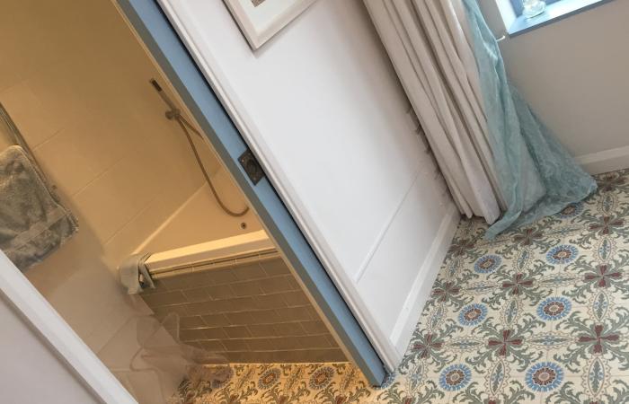 A period French ceramic floor in a London conservatory and bathroom