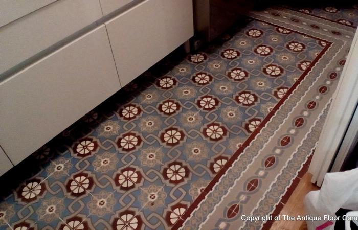 An antique ceramic floor in the kitchen of a Paris apartment