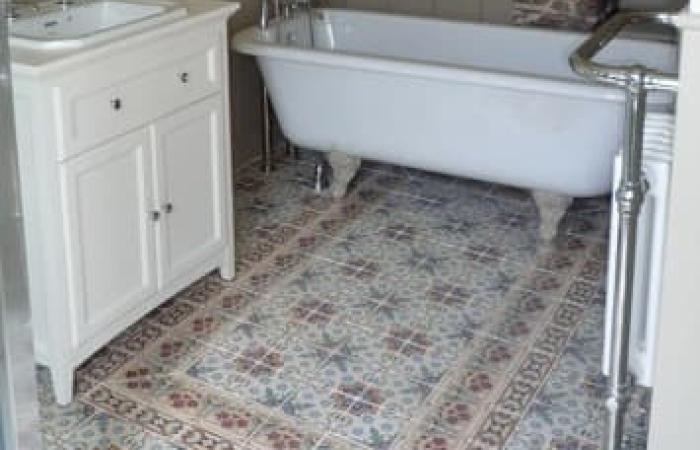 A pretty, floral antique ceramic floor in a Devon Cottage