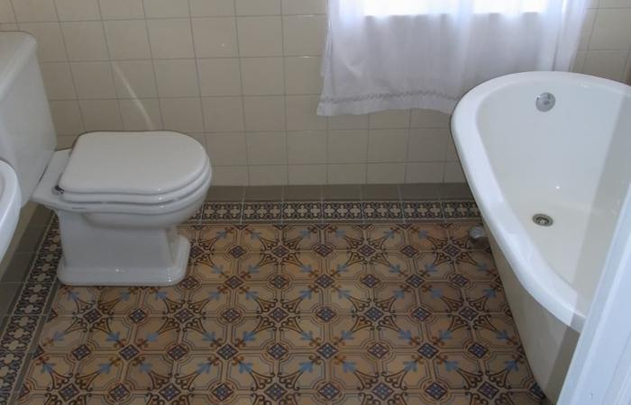 A period octagon ceramic with cabochons in a Gotland, Sweden bathroom 