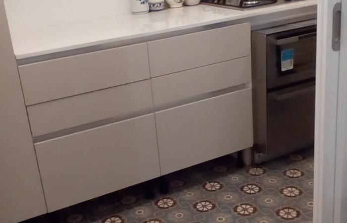 An antique ceramic floor in the kitchen of a Paris apartment An antique ceramic floor in the kitchen of a Paris apartment