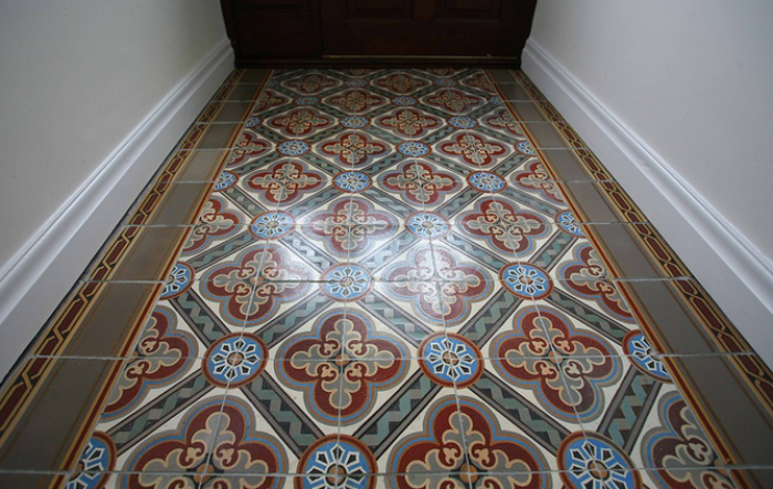 The antique Paray le Monial ceramic tile now relaid in our clients entrance hallway