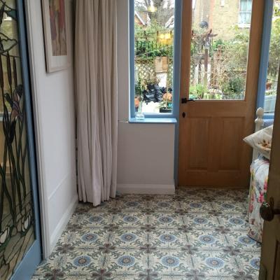 A period French ceramic floor in a London conservatory and bathroom