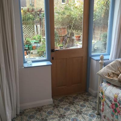 A period French ceramic floor in a London conservatory and bathroom