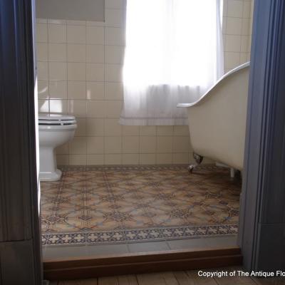 A period octagon ceramic with cabochons in a Gotland, Sweden bathroom 