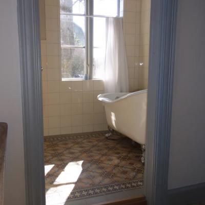 A period octagon ceramic with cabochons in a Gotland, Sweden bathroom 