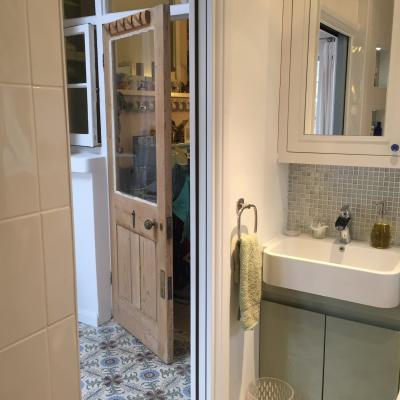 A period French ceramic floor in a London conservatory and bathroom