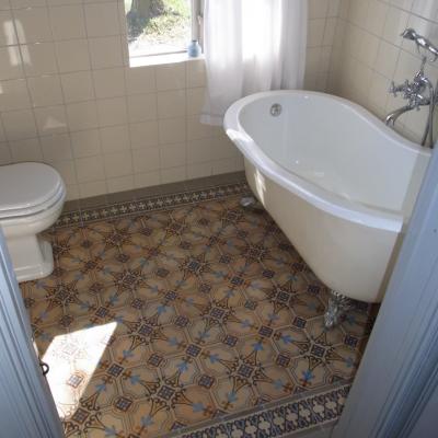 A period octagon ceramic with cabochons in a Gotland, Sweden bathroom 