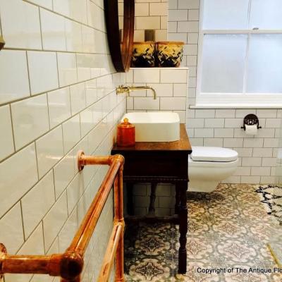 Art Nouveau floor tiles in this London bathroom