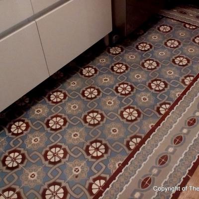 An antique ceramic floor in the kitchen of a Paris apartment