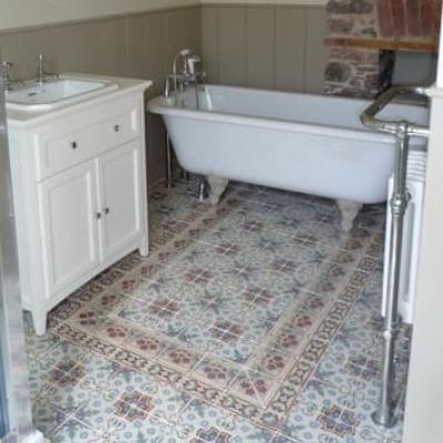 A pretty, floral antique ceramic floor in a Devon Cottage