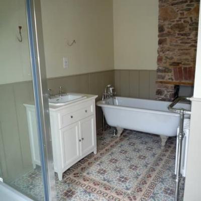 A pretty, floral antique ceramic floor in a Devon Cottage