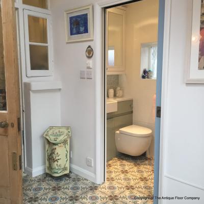 A period French ceramic floor in a London conservatory and bathroom