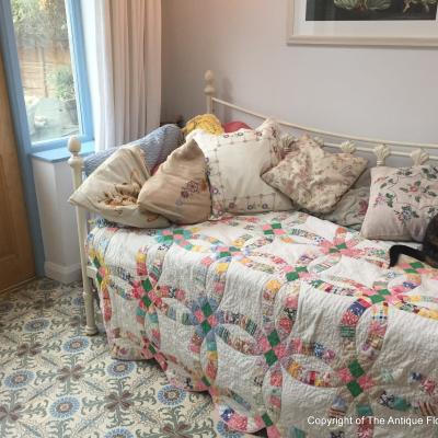 A period French ceramic floor in a London conservatory and bathroom