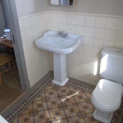 A period octagon ceramic with cabochons in a Gotland, Sweden bathroom 