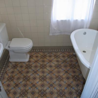 A period octagon ceramic with cabochons in a Gotland, Sweden bathroom 