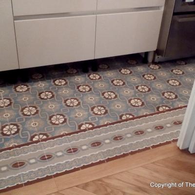 An antique ceramic floor in the kitchen of a Paris apartment