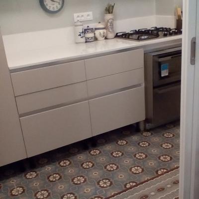 An antique ceramic floor in the kitchen of a Paris apartment