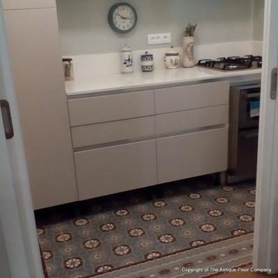 An antique ceramic floor in the kitchen of a Paris apartment