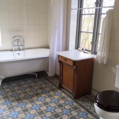 An antique Belgian ceramic in a Swedish country house bathroom