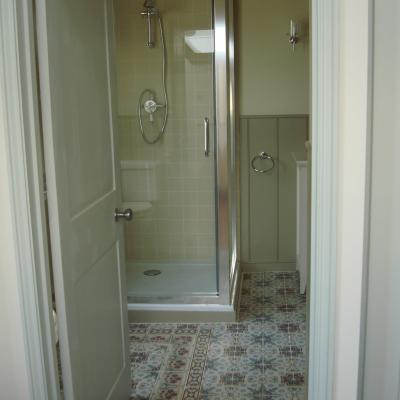 A pretty, floral antique ceramic floor in a Devon Cottage