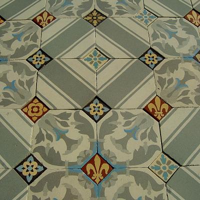 An antique octagon floor with cabochons in a north London hallway