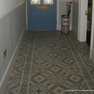 An antique octagon floor with cabochons in a north London hallway