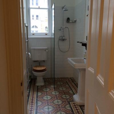 Two antique carreaux de ciment floors adding warmth and colour in this North London home.