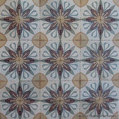 A c.15m2 mosaic themed ceramic floor with lush borders