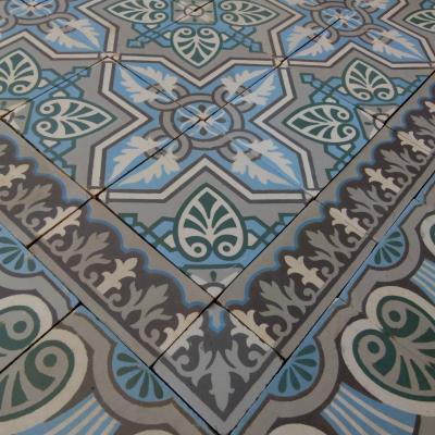 3.75 m2+ antique ceramic vegetal themed floor with half size borders