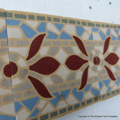 A run of 70+ faux mosaic themed ceramic border tiles 