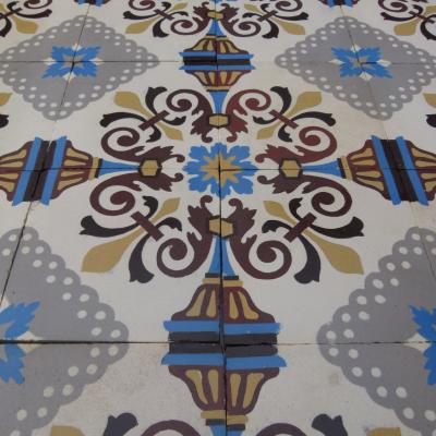 A small antique Belgian ceramic floor with two borders