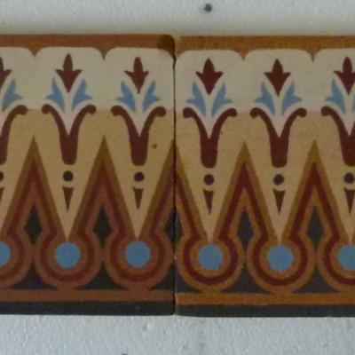 A large run of French Maubeuge ceramic border tiles