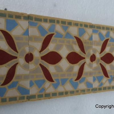 A run of 70+ faux mosaic themed ceramic border tiles 