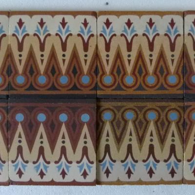 A large run of French Maubeuge ceramic border tiles