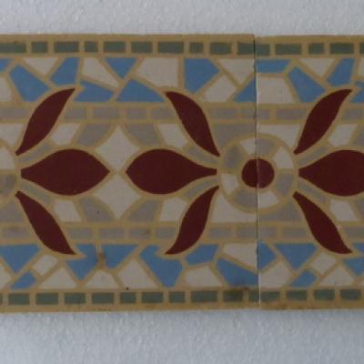 A run of 70+ faux mosaic themed ceramic border tiles 