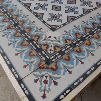 A c.15.3m2 to 19m2 classically French antique ceramic with double borders