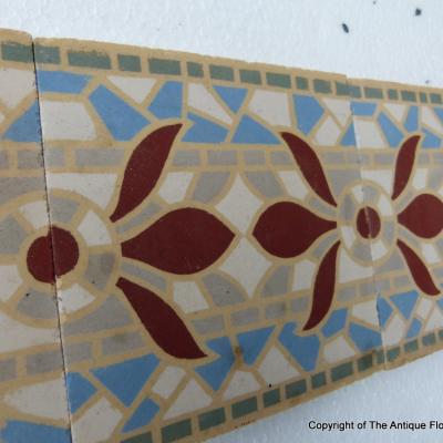 A run of 70+ faux mosaic themed ceramic border tiles 