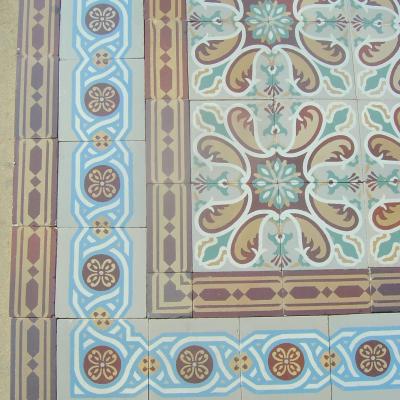 Antique French ceramic floor c.1915 - richly stylised in warm reds