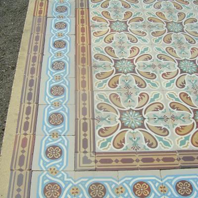 Antique French ceramic floor c.1915 - richly stylised in warm reds