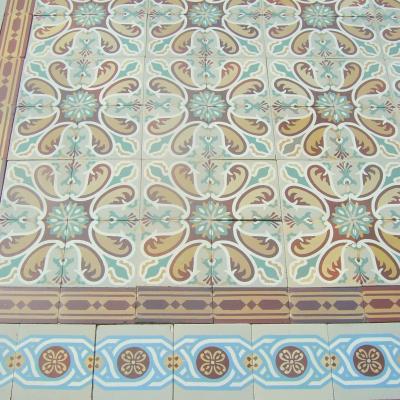 Antique French ceramic floor c.1915 - richly stylised in warm reds