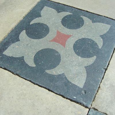 Classic chessboard floor with heraldic motif c.1880