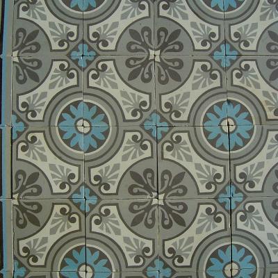 A 32m2+ / 350 sq ft antique ceramic floor in mid grey, blue and cream