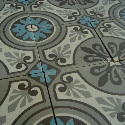 A 32m2+ / 350 sq ft antique ceramic floor in mid grey, blue and cream