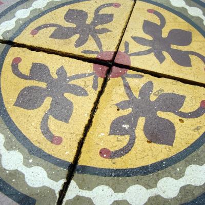 c.7m2 of carreaux de ciments tiles in mustard and lilac c.1910