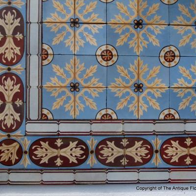 A quality c.24m2 antique ceramic floor with original borders produced by Douvrin c.1900