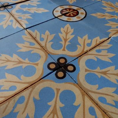 A quality c.24m2 antique ceramic floor with original borders produced by Douvrin c.1900