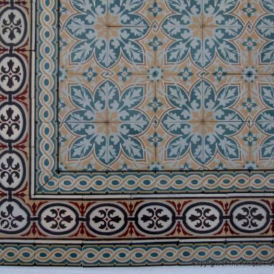 An 11.5m2+ vegetal themed antique French ceramic floor with triple borders